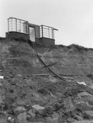 Last wall of a house at Easton Bavents about to succumb to the sea in 1967