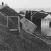 11 am on 1st Feb. Only a few wrecked beach huts remain on the promenade. 