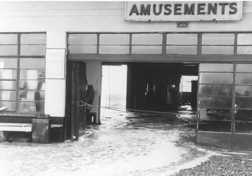 The sea swept through the pier arcade carrying slot machines with it