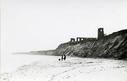 All Saints Church, Dunwich, photographed in 1904 after it had just started falling into the sea