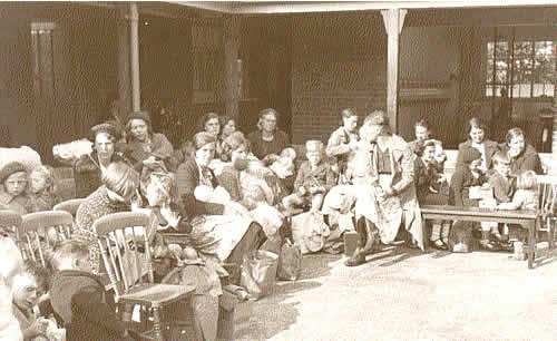 Evacuees from London waiting at Southwold School to be billetted